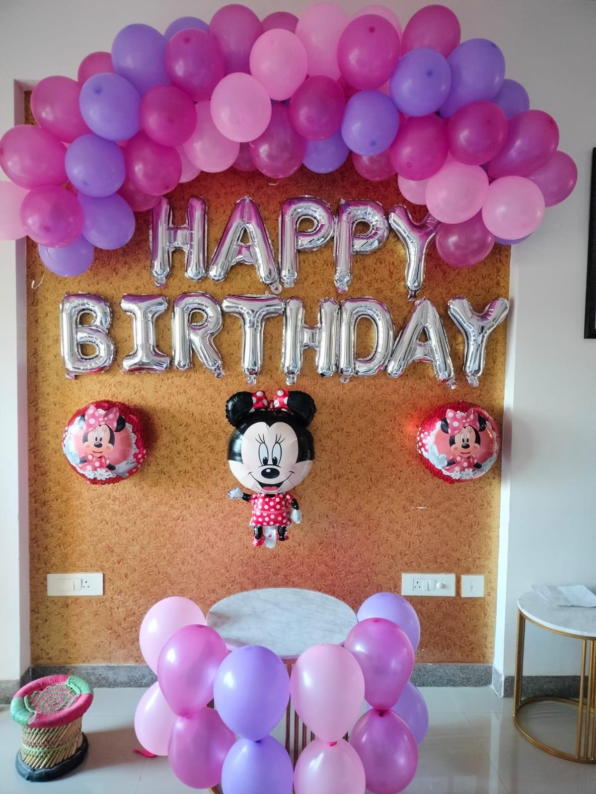 Romantic anniversary room decoration with balloons and roses
